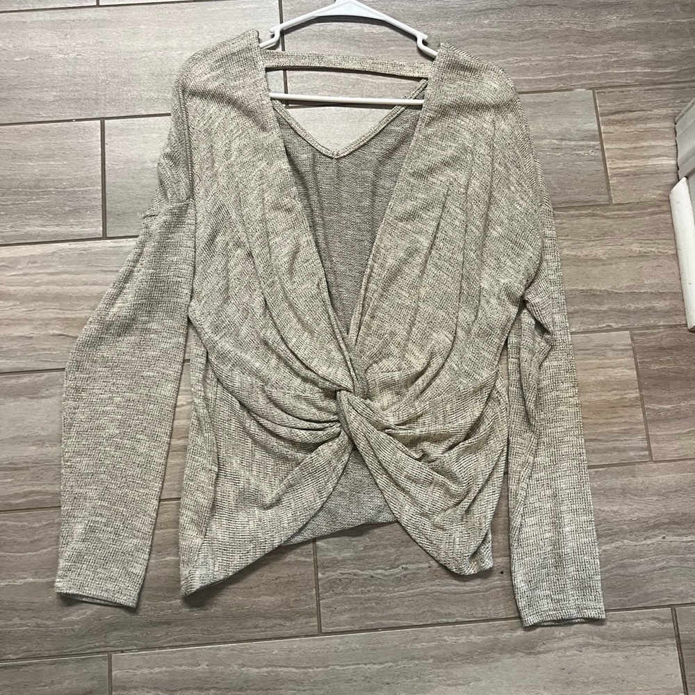 Semi sparkle gold and beige top. Perfect for the holidays. Twist back.